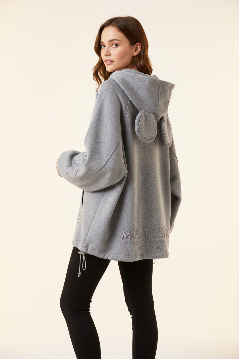 Female model wearing the gray oversized hoodie